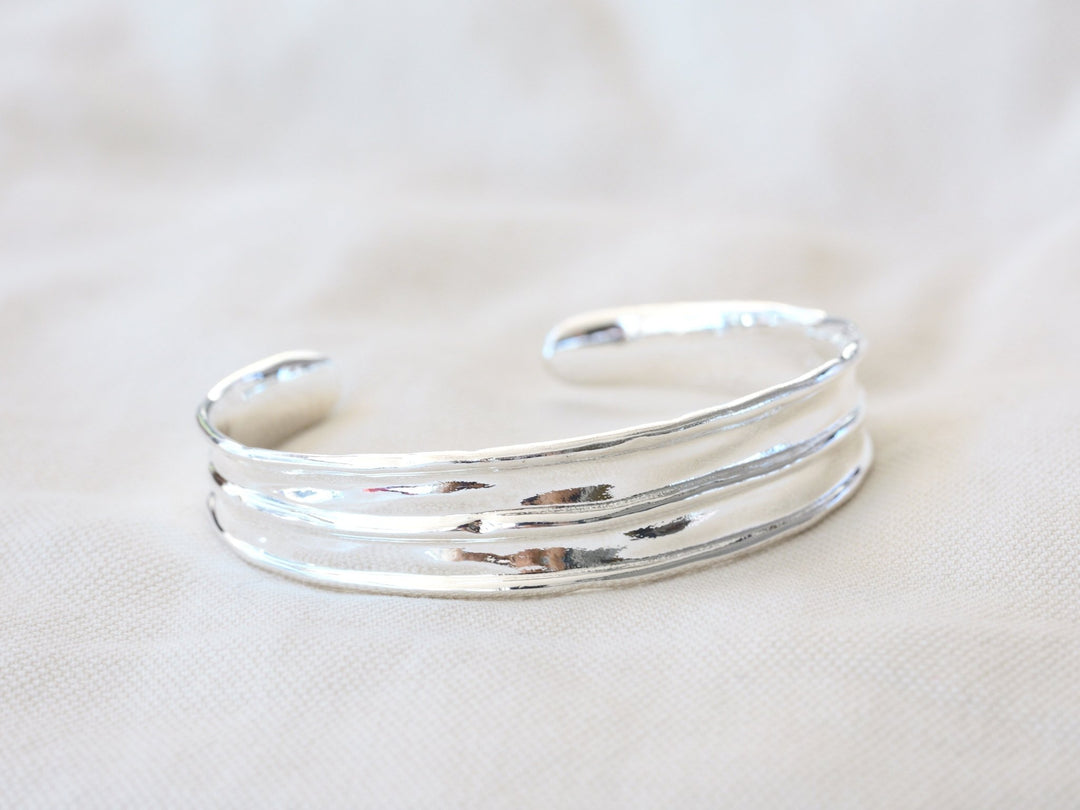 Wide silver bangle with handmade finish - Alicia&