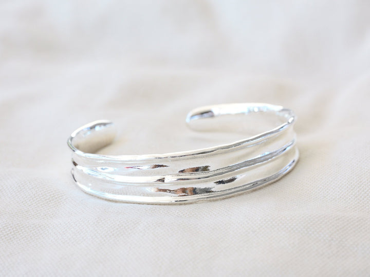 Wide silver bangle with handmade finish - Alicia&