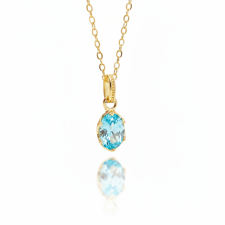 Goldene Halskette mit aquamarin-blauem Kristall in besonderer aufwendiger Fassung aus vergoldetem 925 Sterlingsilber, Schmuck für junge Frauen