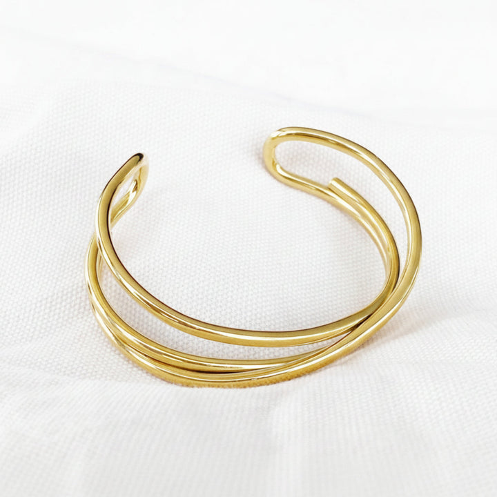 Gold-tone stainless steel bangle - ALICIA&