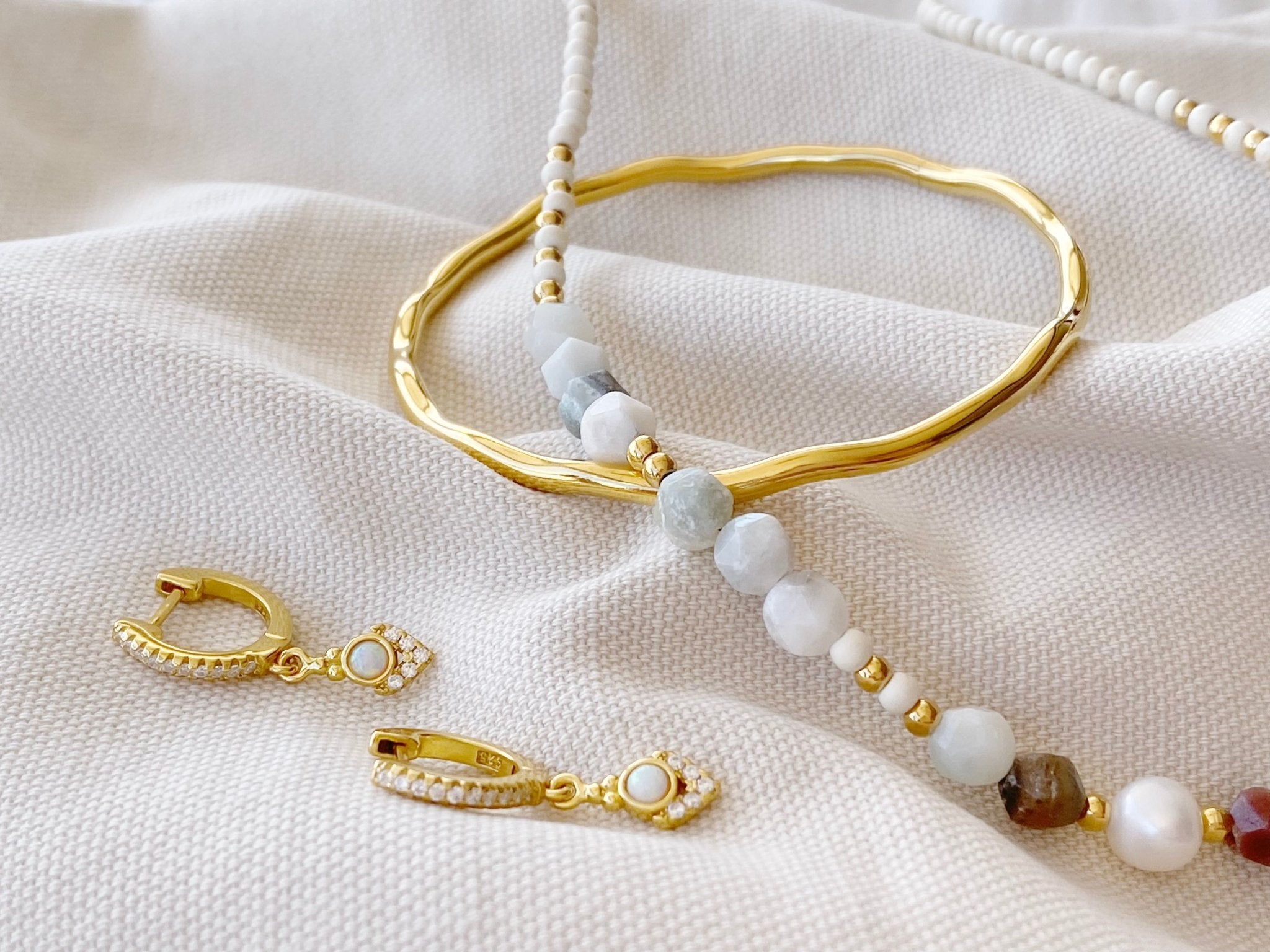 Gold jewelry set consisting of earrings, bracelet and necklace from Alicia's Diary