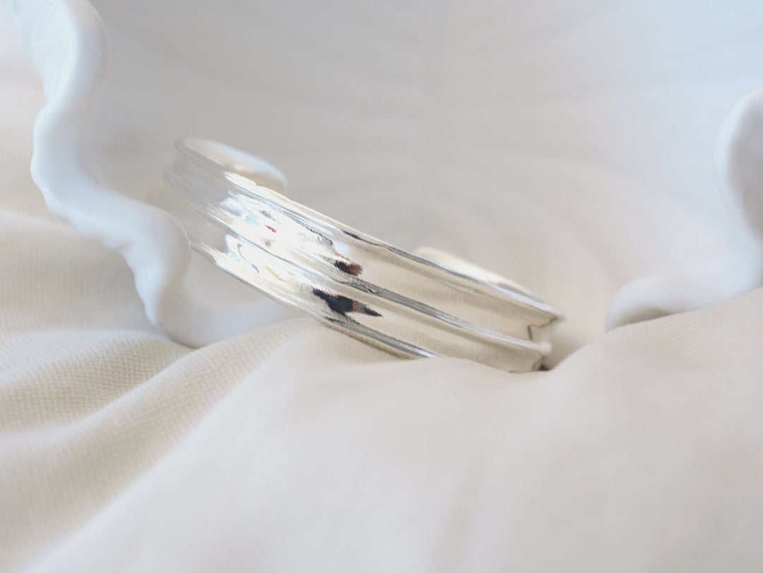 Wide silver bangle with handmade finish - Alicia&