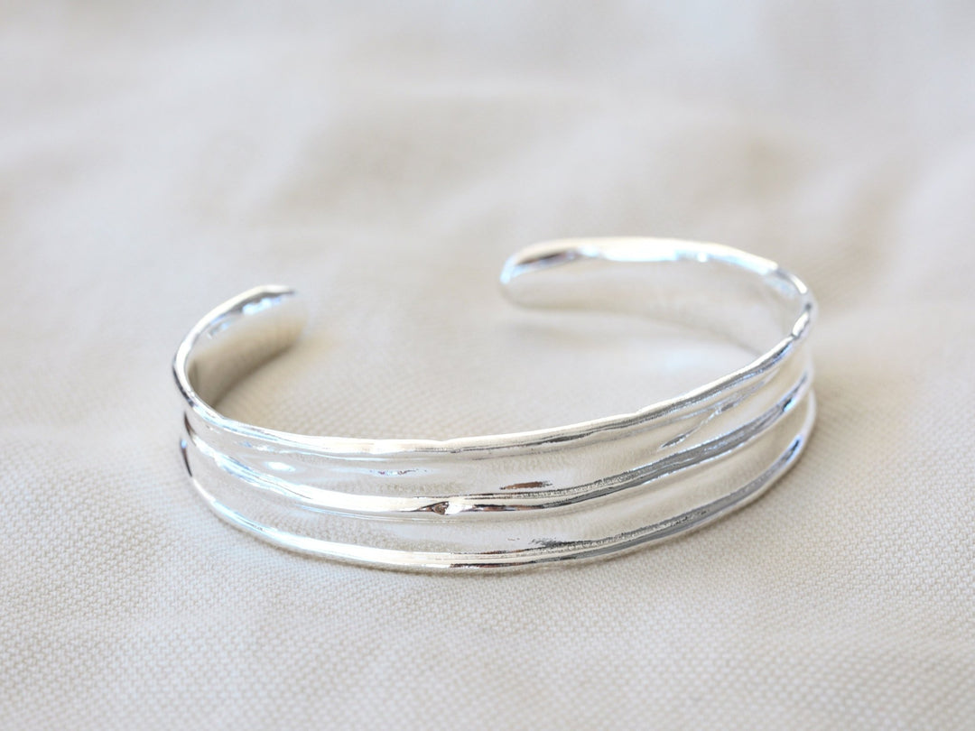 Wide silver bangle with handmade finish - Alicia&