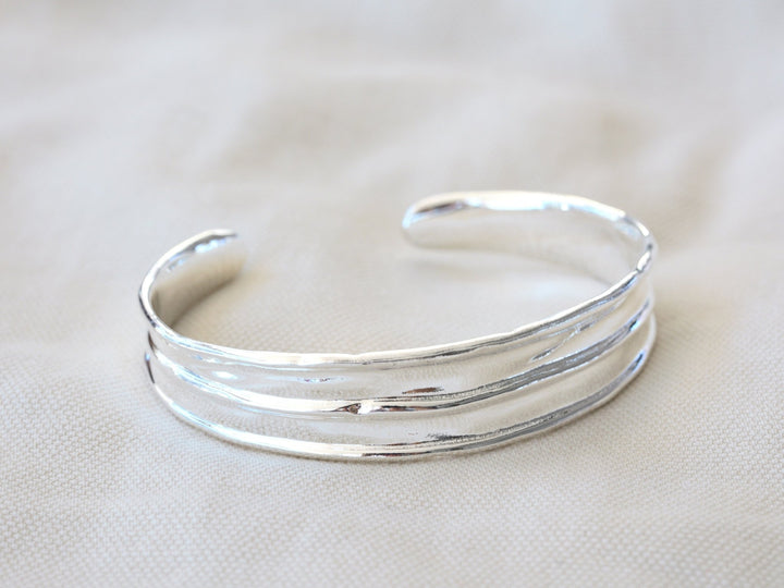 Wide silver bangle with handmade finish - Alicia&